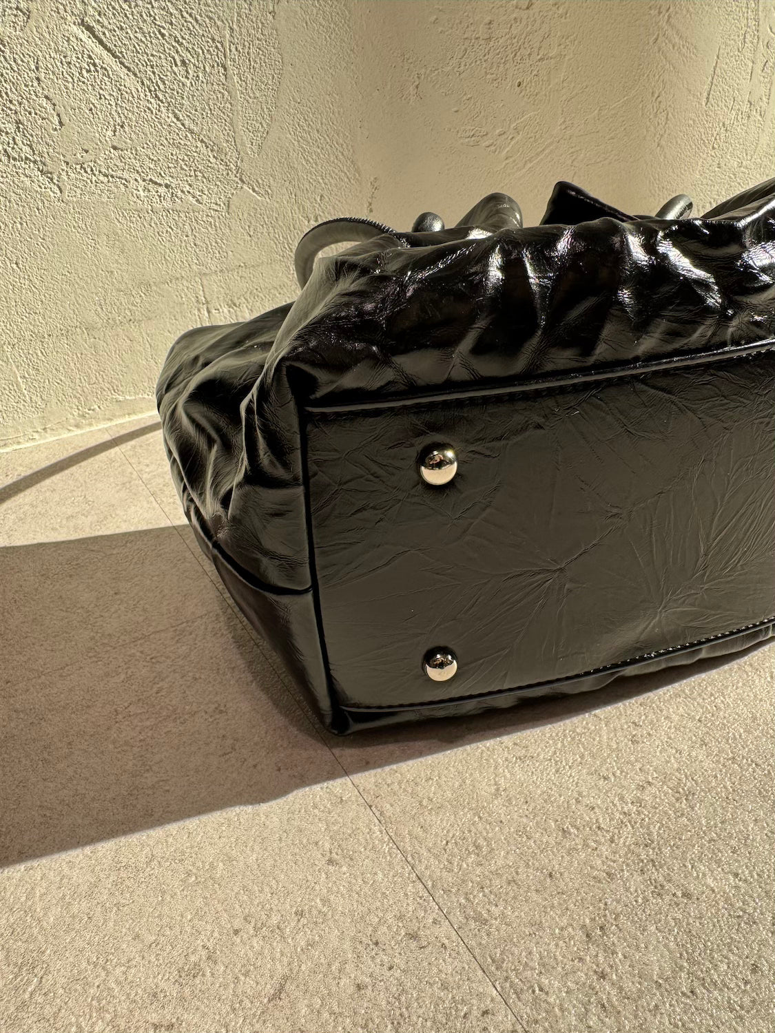 Knot crinkled leather tote