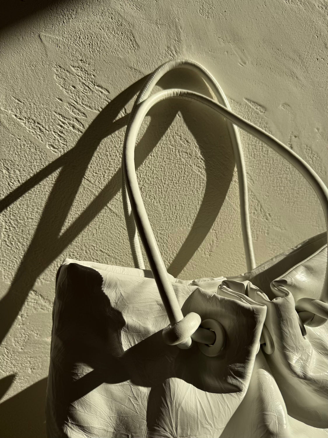 Knot crinkled leather tote